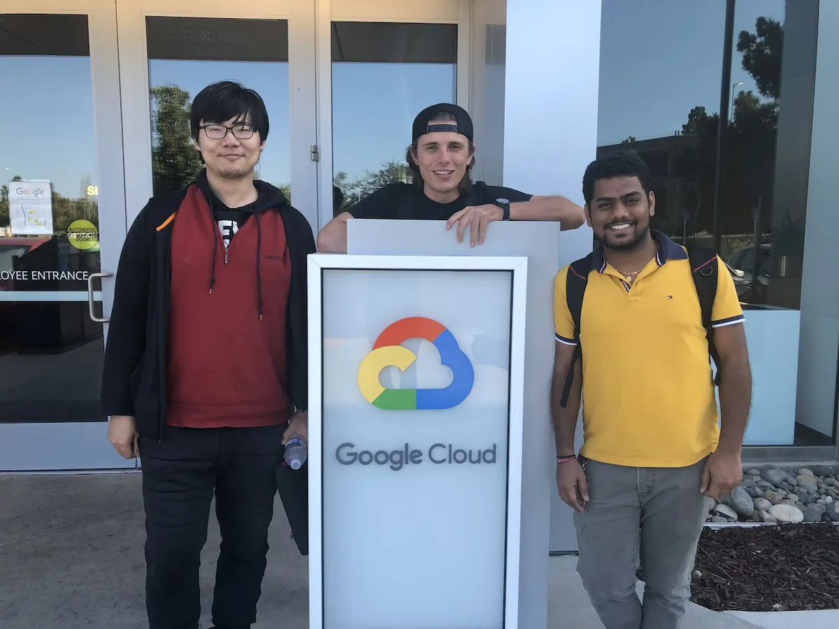 Jade Allen Cook standing with a couple other software engineers in front of the Google Cloud office in Mountain View, California.