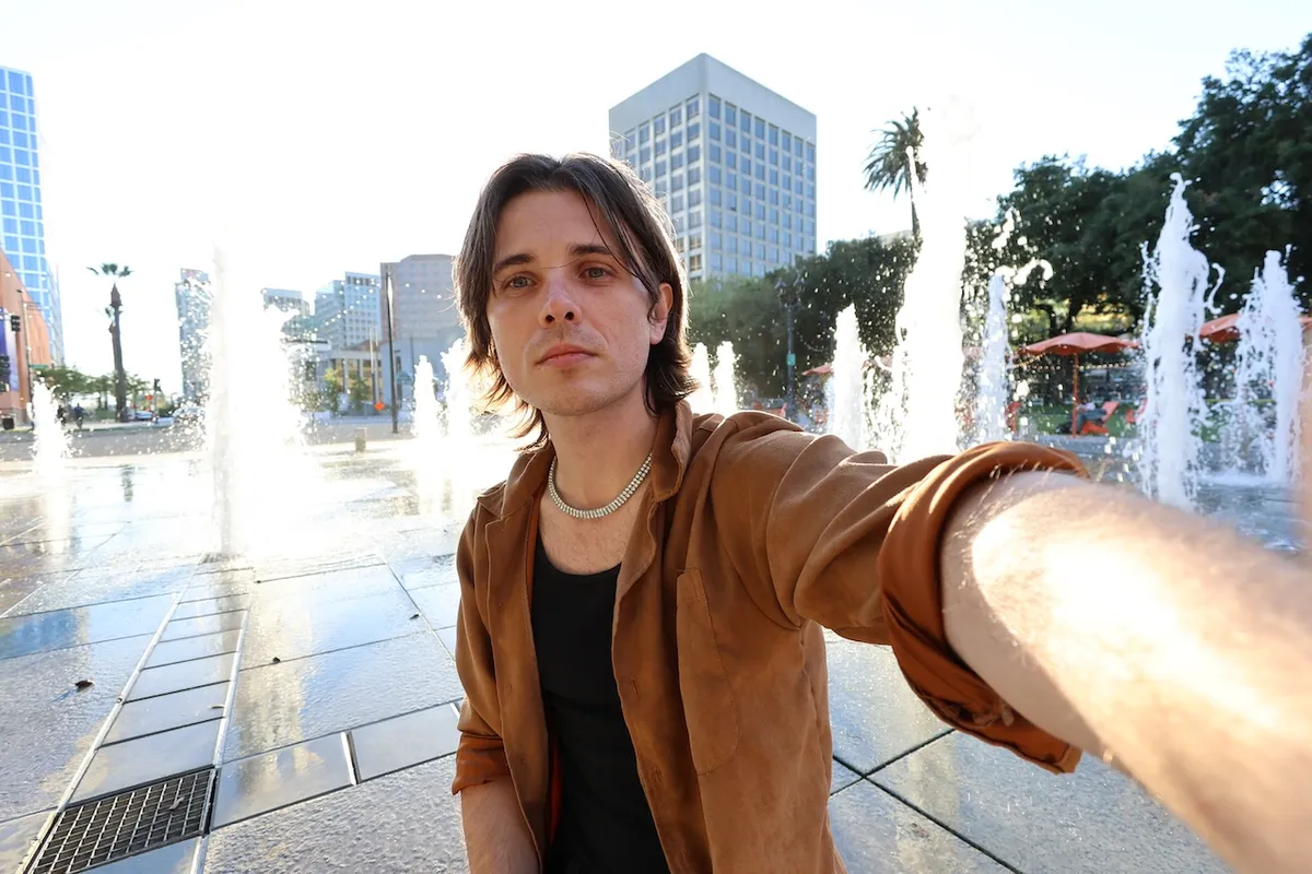 Jade Allen Cook selfie in front of the San Jose fountain.